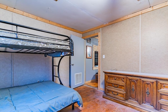 bedroom featuring wood-type flooring