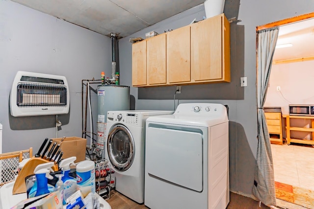 clothes washing area featuring cabinets, gas water heater, separate washer and dryer, and heating unit