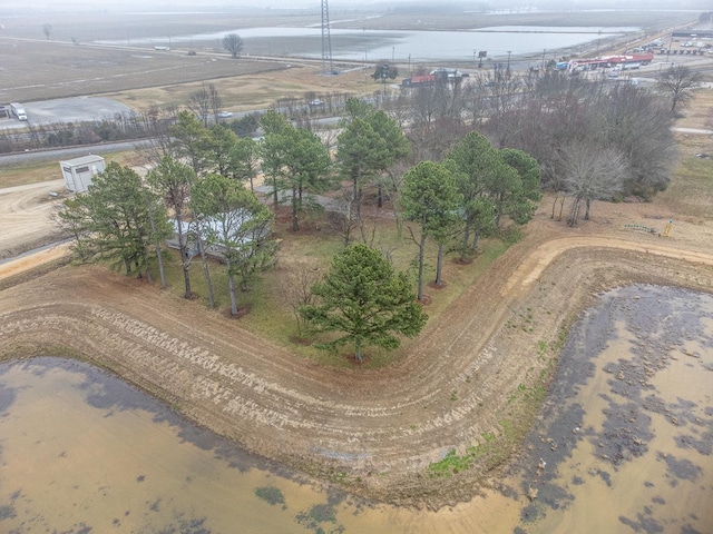 birds eye view of property with a rural view