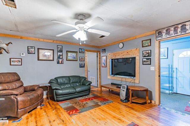 living room with hardwood / wood-style flooring and ceiling fan