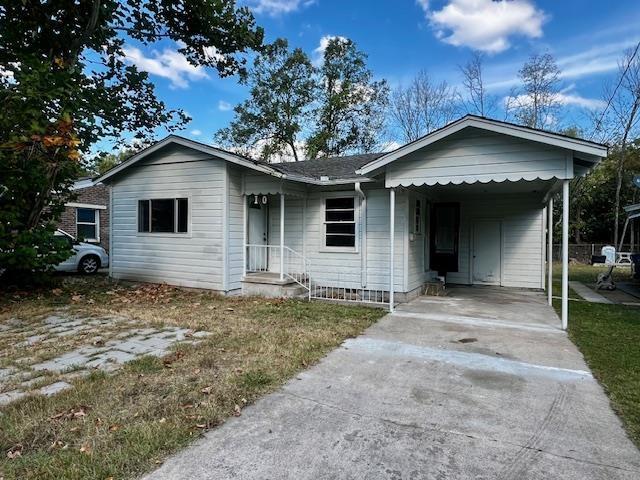 view of front of property with a carport