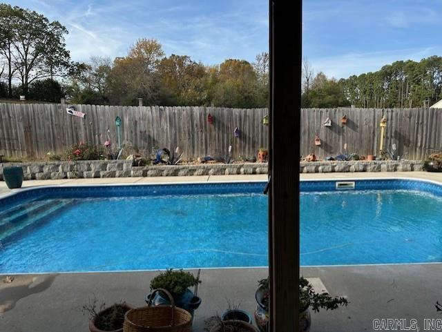 view of pool featuring a fenced in pool and a fenced backyard