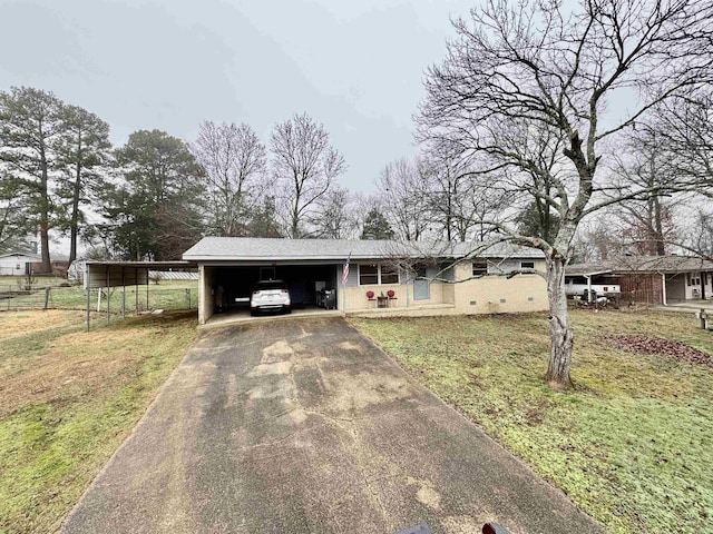 view of front facade with a carport and a front yard