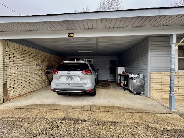 view of vehicle parking with a carport