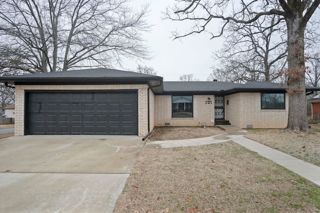 ranch-style home with a garage