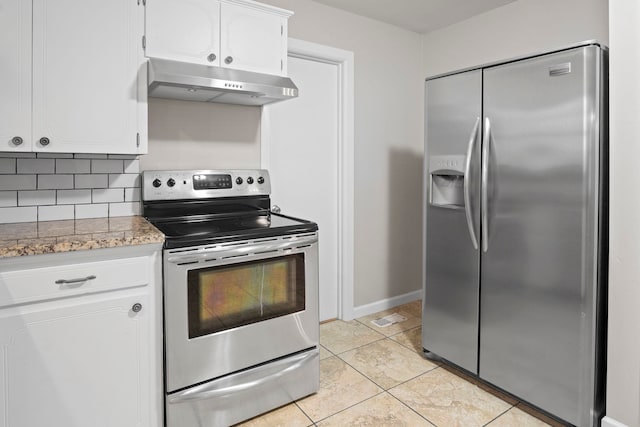 kitchen featuring appliances with stainless steel finishes, white cabinetry, backsplash, light tile patterned floors, and light stone counters