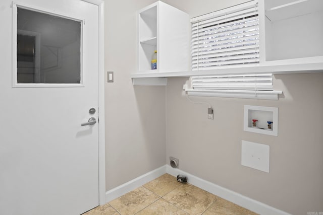 clothes washing area with hookup for a washing machine, hookup for an electric dryer, and light tile patterned floors