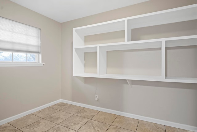 unfurnished room with tile patterned floors