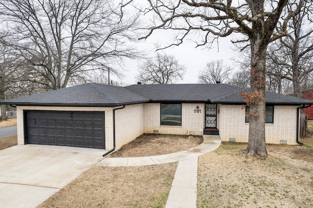 single story home featuring a garage