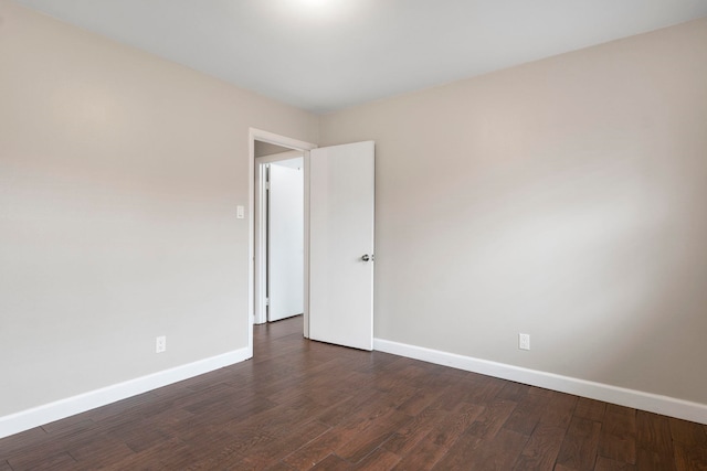 unfurnished room featuring dark hardwood / wood-style flooring