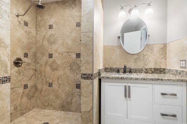 bathroom featuring vanity and a tile shower