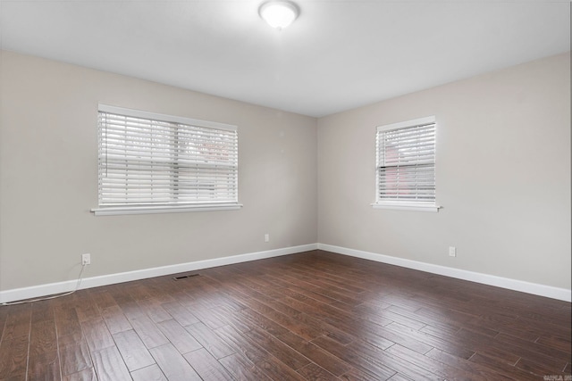 empty room featuring dark hardwood / wood-style floors