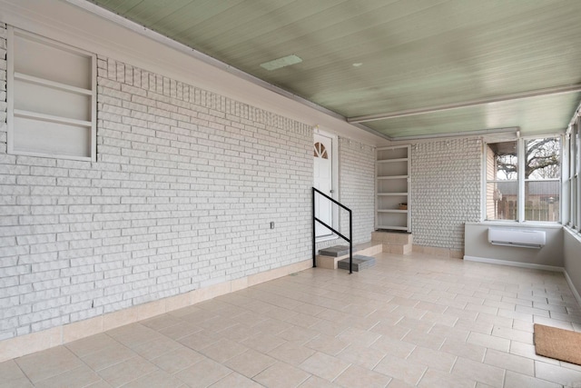 unfurnished sunroom featuring wood ceiling and a wall unit AC