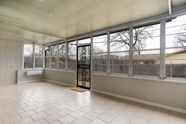 unfurnished sunroom featuring wood ceiling