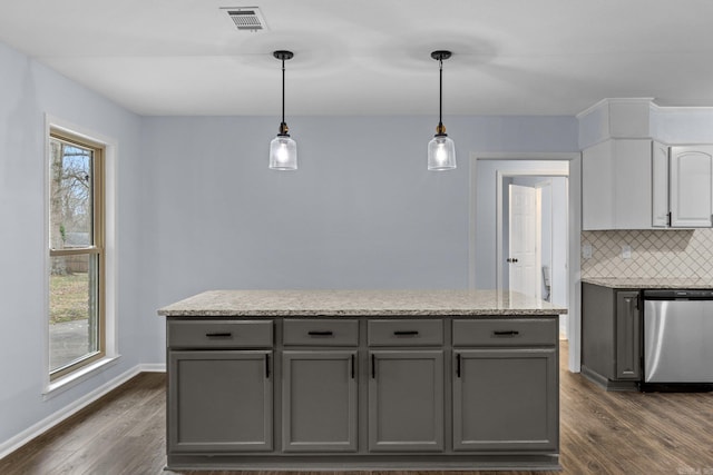 kitchen with hanging light fixtures, dark wood-type flooring, gray cabinets, and dishwasher