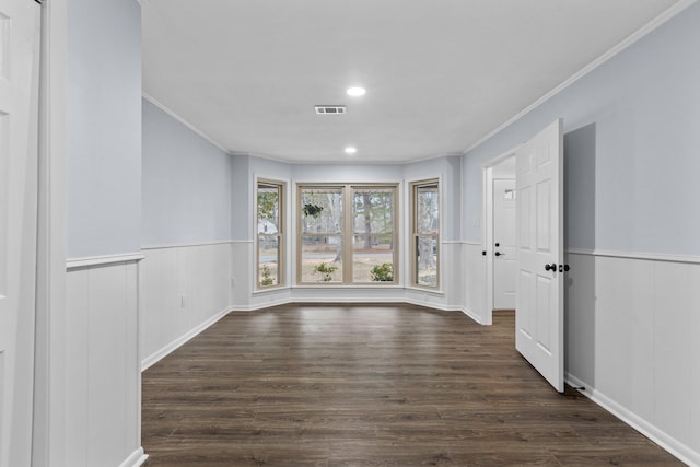 interior space with dark wood-type flooring and crown molding