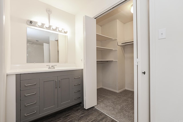 bathroom with vanity and hardwood / wood-style floors