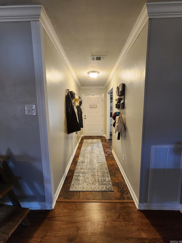 corridor with crown molding and dark wood-type flooring