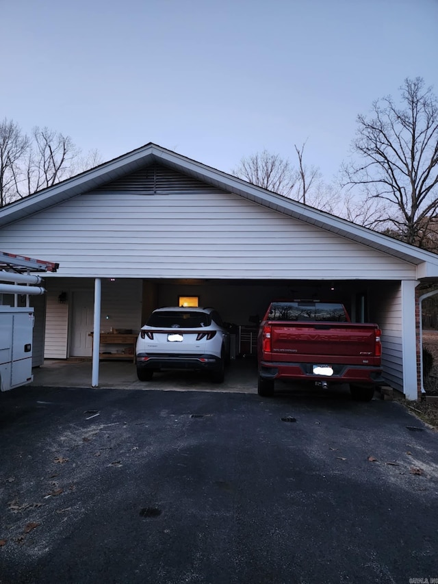 garage featuring a carport