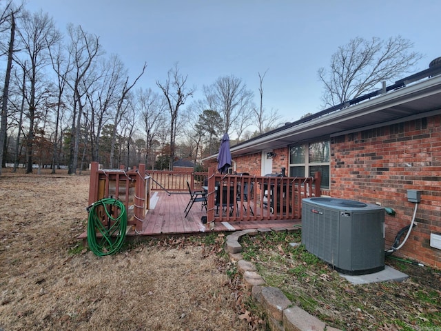 exterior space featuring a wooden deck and central AC unit