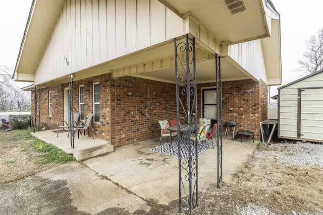 view of patio featuring a storage shed