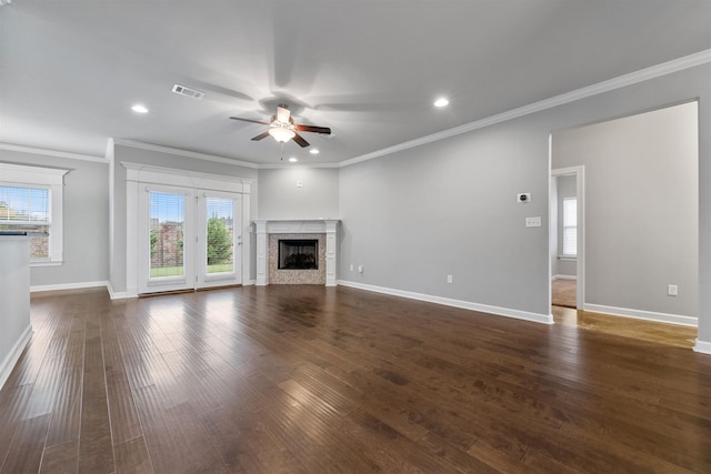 unfurnished living room featuring crown molding, ceiling fan, and dark hardwood / wood-style floors