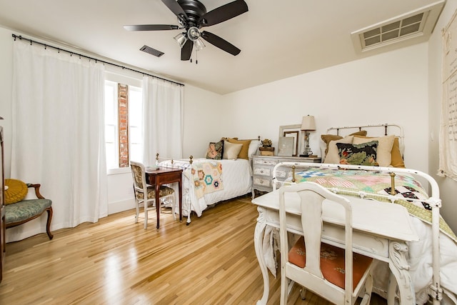 bedroom featuring light hardwood / wood-style floors and ceiling fan