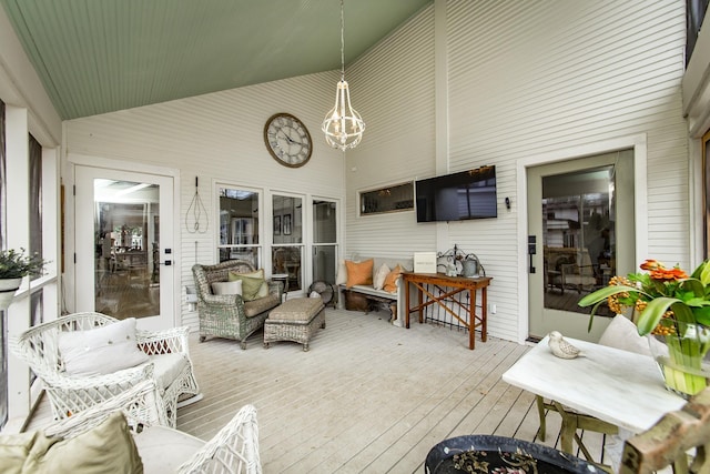 sunroom / solarium with vaulted ceiling