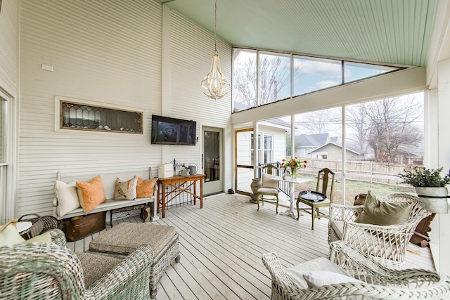 sunroom with a chandelier