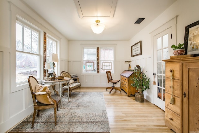 sitting room featuring light hardwood / wood-style floors