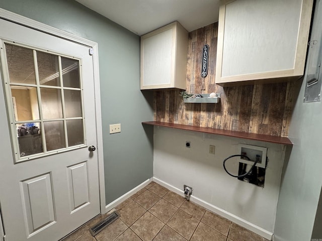 laundry room featuring washer hookup, hookup for an electric dryer, and light tile patterned floors