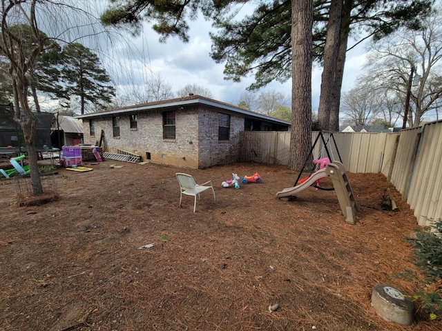 view of home's exterior featuring a trampoline