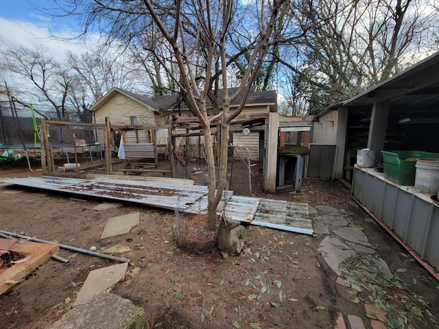 view of yard with a trampoline