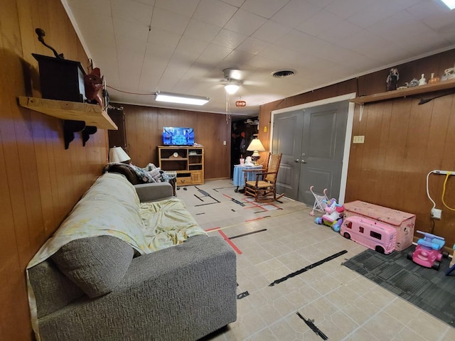 living room with wood walls