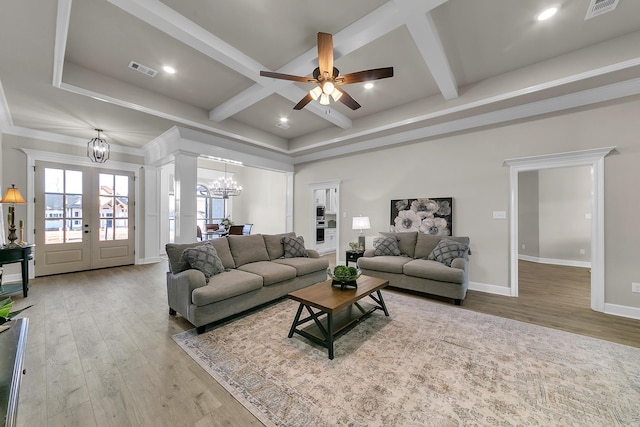 living room with french doors, coffered ceiling, hardwood / wood-style floors, and beamed ceiling