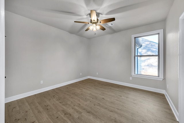 unfurnished room with ceiling fan and light hardwood / wood-style flooring