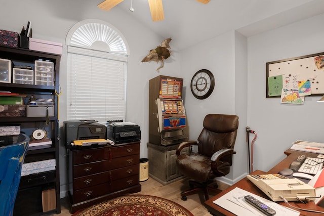 office featuring vaulted ceiling, light hardwood / wood-style floors, and ceiling fan