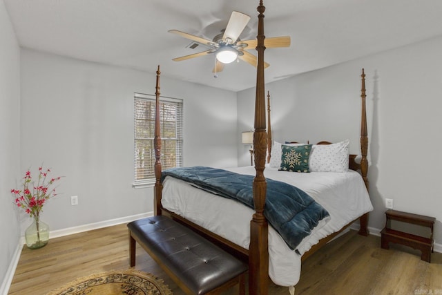 bedroom featuring hardwood / wood-style floors and ceiling fan