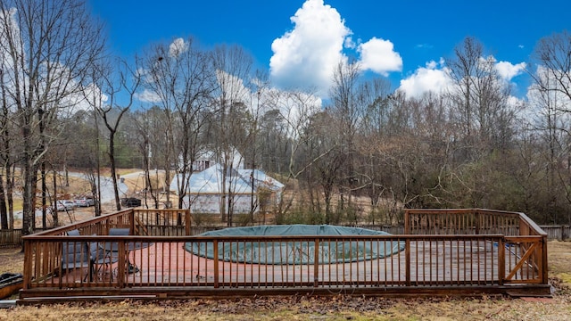 view of pool with a wooden deck