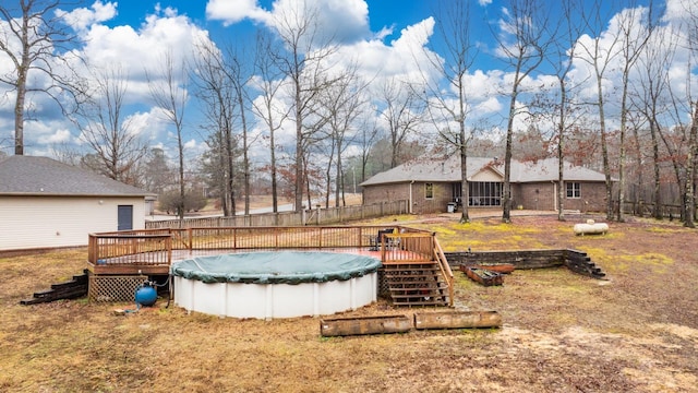 view of swimming pool with a wooden deck