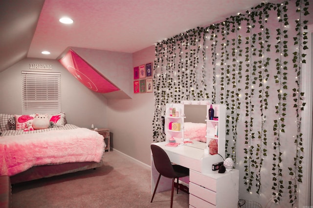 carpeted bedroom with lofted ceiling