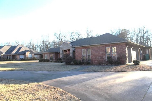 single story home with a garage