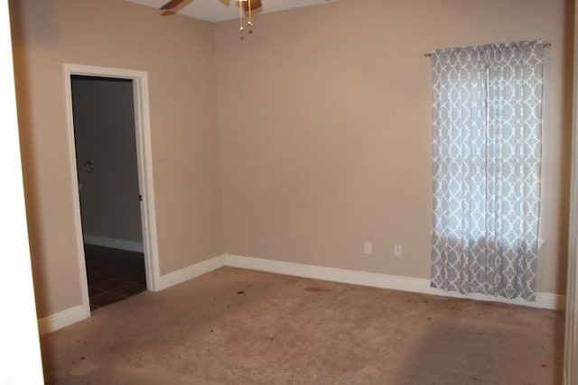 unfurnished room with light colored carpet and ceiling fan