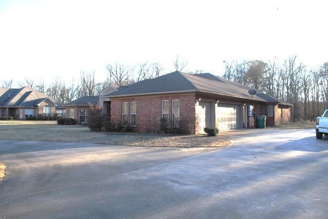 view of side of property featuring a garage