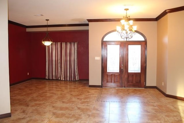 tiled foyer with a notable chandelier, crown molding, and french doors