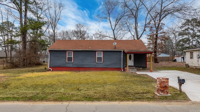 view of front of property with a front yard and covered porch