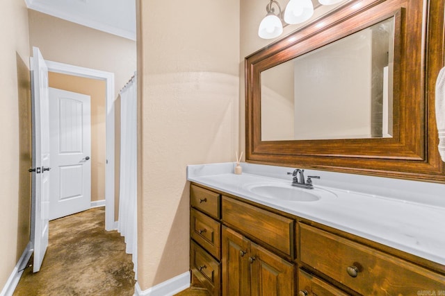 bathroom featuring vanity and crown molding