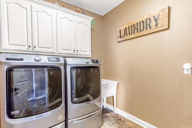 laundry room with cabinets and independent washer and dryer