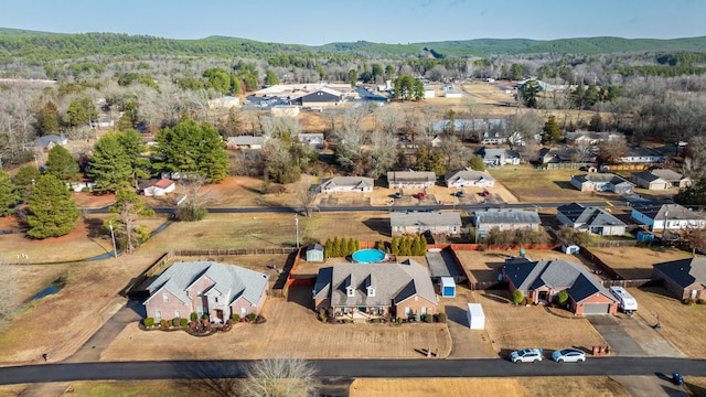 birds eye view of property with a mountain view