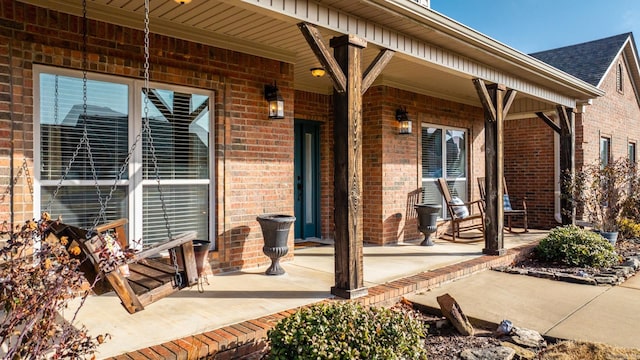 view of patio featuring a porch